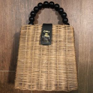 Wicker bag with black beaded handle